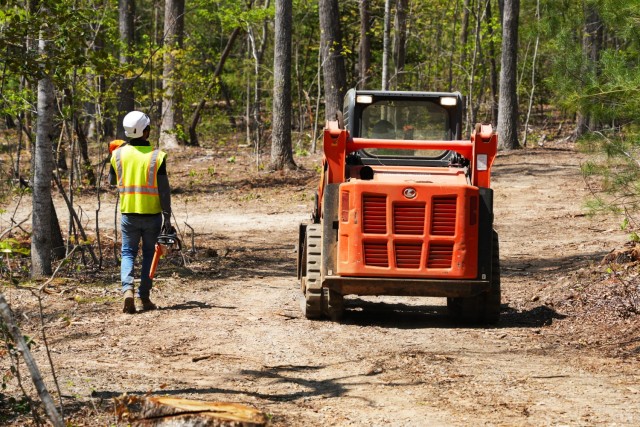 Contractors working under the direction of the U.S. Army Corps of Engineers clear storm debris from Hurricane Helene at the Boy Scouts of America's Camp Grimes in McDowell County, North Carolina, April 18, 2025. The removal effort is part of a...