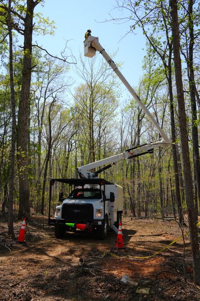 Contractors working under the direction of the U.S. Army Corps of Engineers clear storm debris from Hurricane Helene at the Boy Scouts of America's Camp Grimes in McDowell County, North Carolina, April 18, 2025. The removal effort is part of a...