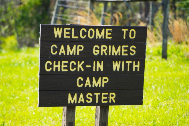 A sign welcomes visitors to Camp Grimes in McDowell County, North Carolina, April 18, 2025. The 1,100-acre Boy Scout camp is undergoing debris removal as part of a FEMA-assigned mission led by the U.S. Army Corps of Engineers following Hurricane...