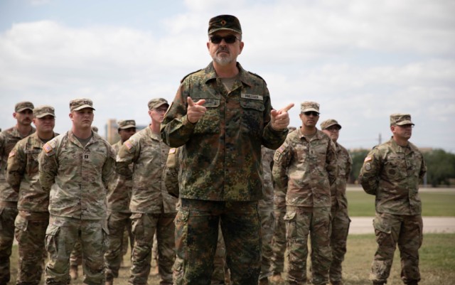Lt. Col. Joerg Presser, the German liaison to the Fire Center of Excellence based out of Fort Sill, Oklahoma, gives a speech during an award ceremony for the German Armed Forces Badge for Military Proficiency at the Sadowski Field on Fort Cavazos,...