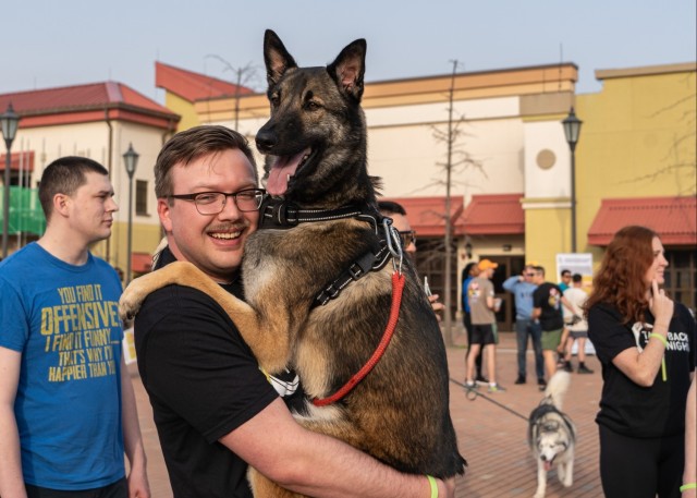 Man poses with his dog