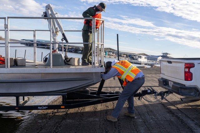 Natural Resource Specialist Jim Bell (on the boat) and Geotechnical Engineer Zackary Young doing final boat checks before launching it into Hillsdale reservoir for members of the inspection team travel on the lake to inspect the exterior of the...