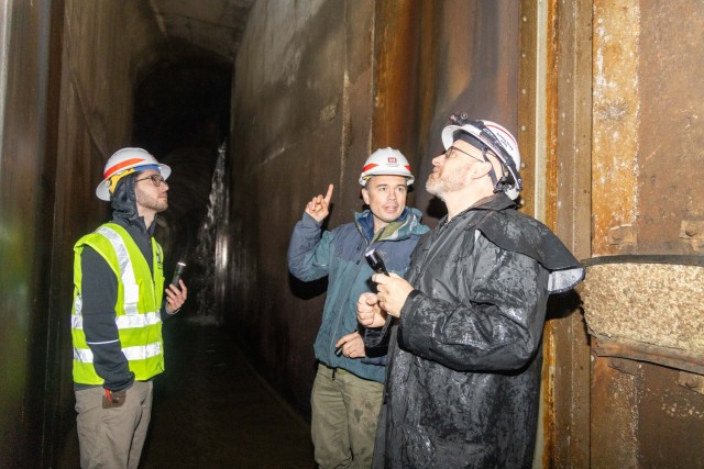 Hydraulic Engineer Ben Johnson (center) detailing some of his findings to Maintenance Engineering Section Chief J.C. Randazzo Dozzle and Hydrogeology Civil Engineer Conner Szarwinski after inspecting the service gate components inside Hillsdale...