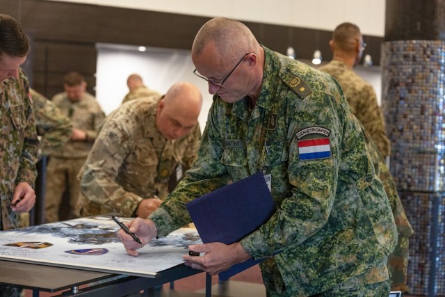 Netherland's Sgt. Maj. Peter Marten signs a banner to present to Estonian military leadership during the 18th Annual Conference of European Armies for Noncommissioned Officers (CEANCO) in Tallinn, Estonia, April 17, 2025. CEANCO is the premier...