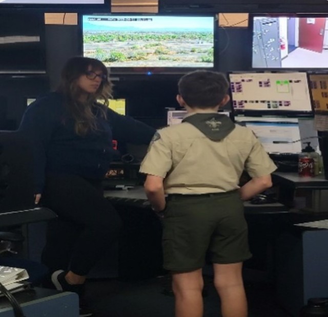Boy Scout talking with 911 dispatcher.