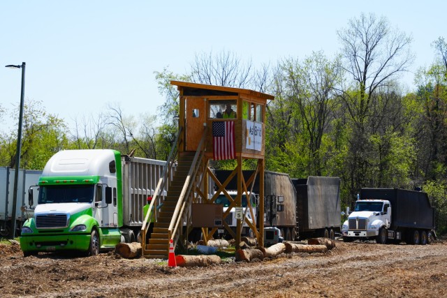 Trucks line up at the debris load inspection tower where U.S. Army Corps of Engineers personnel inspect and document each load of debris at the Old Fort Debris Management Site in Old Fort, North Carolina, April 9, 2025. The process ensures...