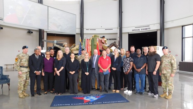 Central Technical Support Facility personnel, flanked by the CECOM command team, pose for a photo following the casing of the colors for the Central Technical Support Facility at Fort Cavazos, Texas, April 28, 2025. Following a recent change of...