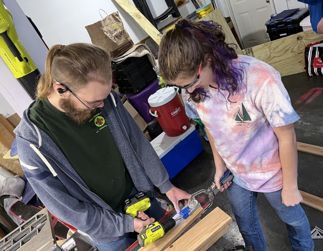 Aidan Harris assists Elizabeth Faught with the building of a donation drop-off box for the Fort Leavenworth Stray Facility, part of Elizabeth’s Eagle Scout project, April 20, 2025. Submitted photo by Darcy Richard