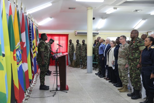 Attendees stand for the Trinidad and Tobago national anthem at Teteron Barracks, Chaguaramas, Trinidad and Tobago during TRADEWINDS 25 (TW25) on April 26, 2025. TW25 is a U.S. Southern Command-sponsored and Chairman of the Joint Chiefs of...