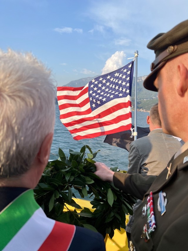 The Mayor of Nago Torbole, Gianni Morandi and Col. Scott Horrigan, commander of U.S. Army Garrison Italy, prepare to present a wreath on Lake Garda, directly above where a DUKW amphibious vehicle sank during WWII