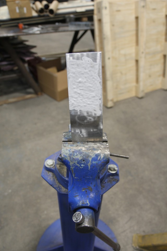 A piece of metal is coated with cold spray.