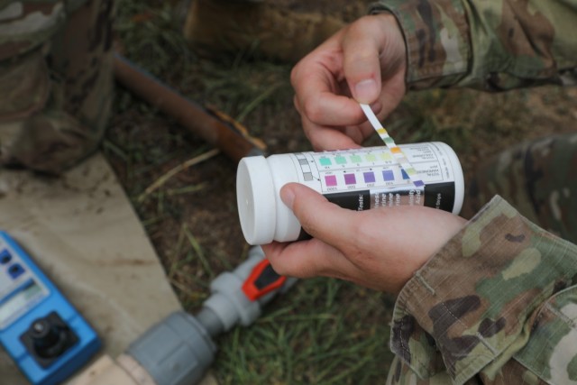 Sgt. Jessica Shields, a water purification specialist with the 935th Aviation Support Battalion, Missouri Army National Guard, checks the chlorine levels of the water meant for cooking and cleaning laundry during TRADEWINDS 25 exercise at Teteron...