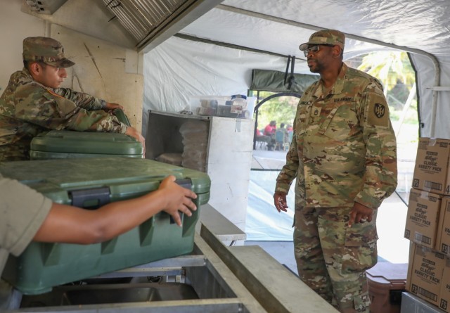 U.S. Army Sgt. 1st Class, Antoine Collins, the 5001st Field Feeding Company, 167th Theater Sustainment Command, Alabama Army National Guard noncommissioned officer in charge, inspects kitchen clean up during TRADEWINDS 25 (TW25) at Tetron Bay,...