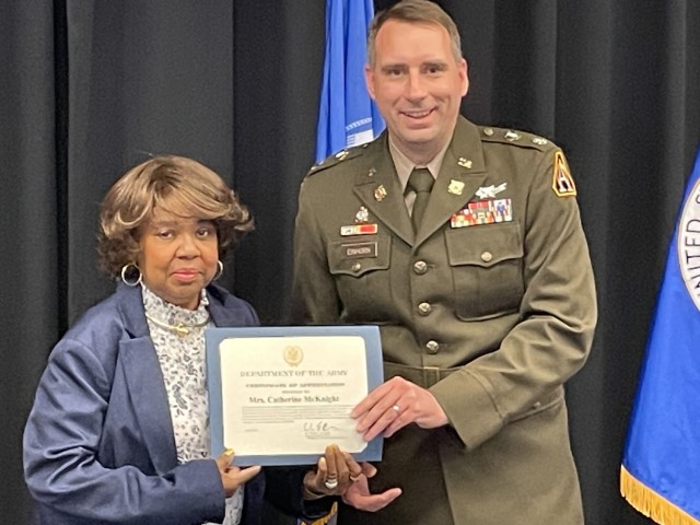 Catherine McKnight receives a Department of the Army Certificate of Appreciation.