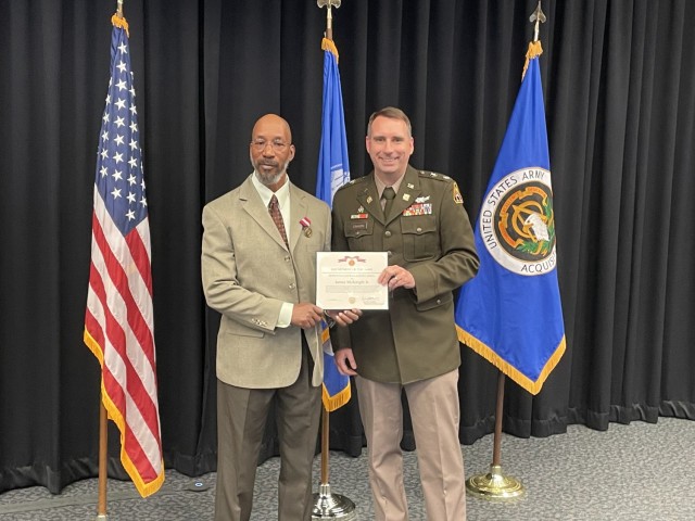 James McKnight Jr. with his Department of the Army Retirement Certificate and Pin.