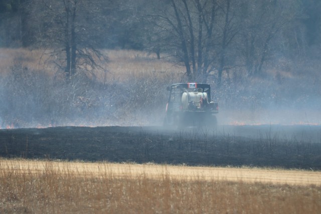 Members of the Fort McCoy prescribed burn team oversee a prescribed burn April 23, 2025, on Badger Drop Zone on South Post at Fort McCoy, Wis. The post prescribed burn team includes personnel with the Fort McCoy Directorate of Emergency Services...