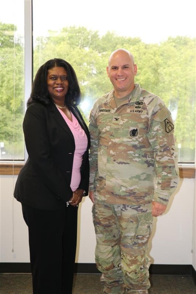 Colonel Brock Zimmerman, Project Manager Aircraft Survivability Equipment (PM ASE) (r) and Kassel Kendricks, Management Analyst PM ASE, express their appreciation for the overwhelming generosity of the organization.