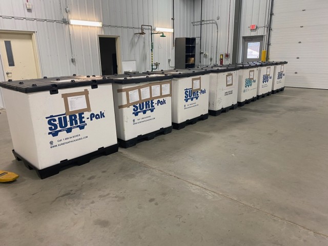 Bins containing old phones are shown March 4, 2025, in a warehouse building at Fort McCoy, Wis. Old phones were collected by the Fort McCoy Garrison Information Management Office after the installation completed a telecommunications switch from...