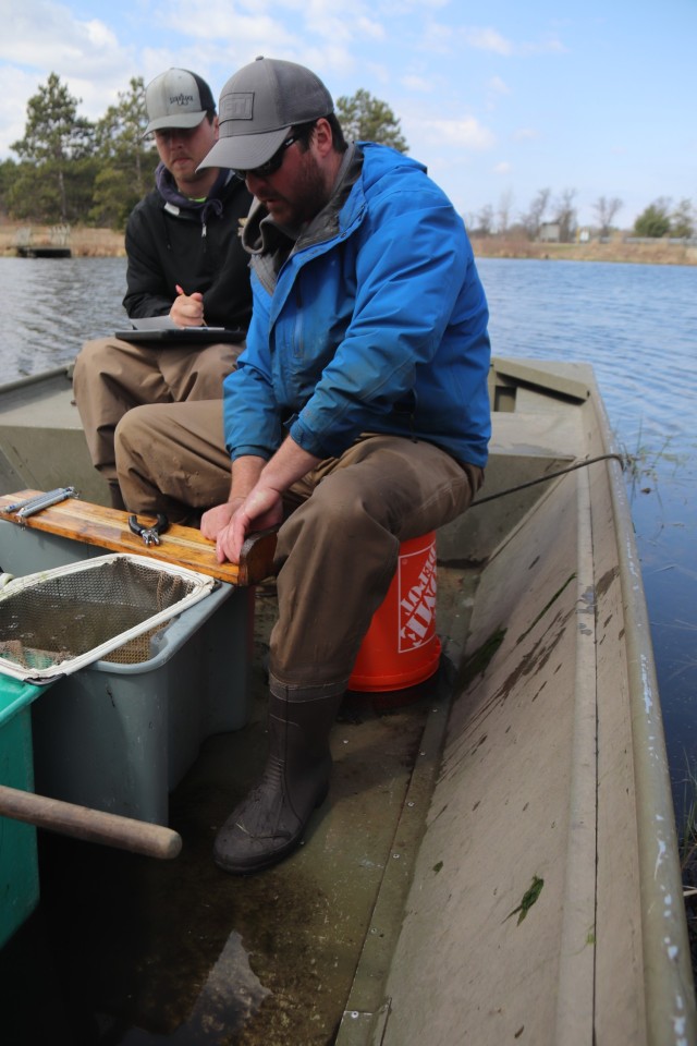 Watershed Management Biologist Derek Maki and Watershed Management Specialists Jaden Gallardo and Trenton Foreman with Colorado State University conduct a fish survey April 22, 2025, at Stillwell Lake on South Post at Fort McCoy, Wis. They...