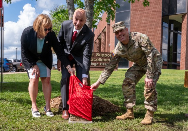 Sharise Spellmon; retired Lt. Gen. Scott Spellmon, 55th Chief of Engineers of the U.S. Army Corps of Engineers; and Col. Stephen Kolouch, U.S. Army Engineer School commandant, unveil a dedication marker May 1 in the Chief of Engineers Grove of the...