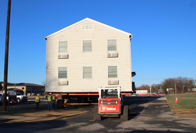 A barracks building from the 1600 block at Fort McCoy, Wis., is shown being moved April 16, 2025, from the 1600 block to another area of the installation. Contractors are moving several buildings in 2025. These buildings will eventually be reset...