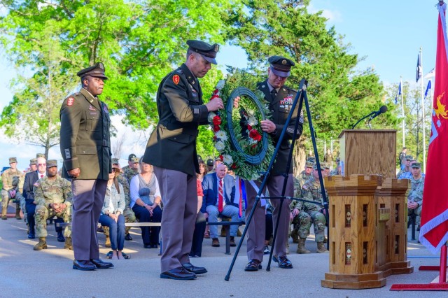Col. Stephen Kolouch, U.S. Army Engineer School commandant, and U.S. Army Engineer Regimental Command Sgt. Maj. Zachary Plummer, lay a wreath May 1 in Sapper Grove during a memorial service to honor the fallen.