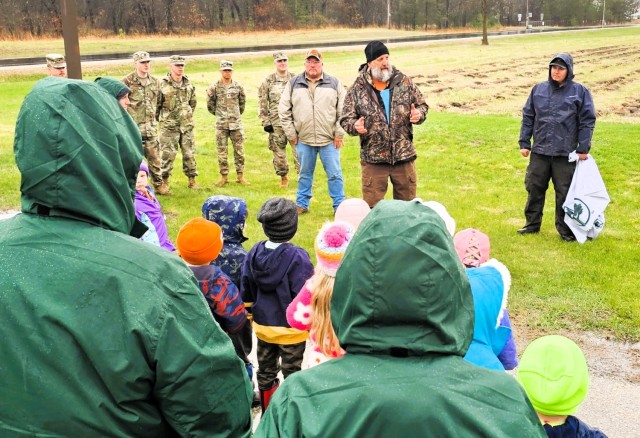 Fort McCoy community members plant trees April 25, 2025, during a tree-planting event at Fort McCoy, Wis. Dozens of community members planted 500 trees on the installation cantonment to establish a tree break. The installation also received its...