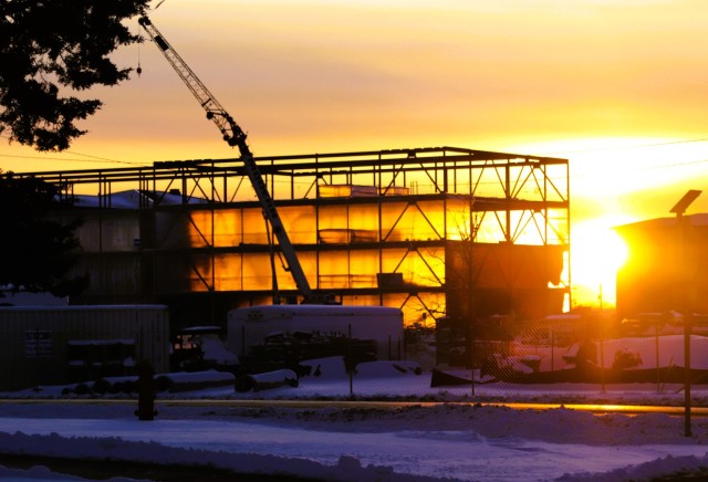 Contractors work on a new $27.3 million transient training troops barracks project, known as the Fort McCoy East Barracks Project, is shown at sunset on Dec. 20, 2024, at Fort McCoy, Wis. Contractors began in May 2024 getting the site set up for...