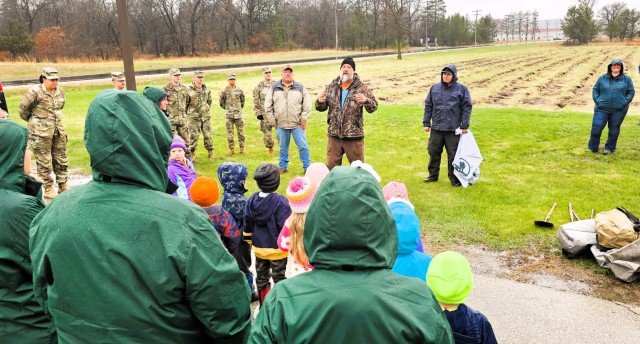 Fort McCoy community members plant trees April 25, 2025, during a tree-planting event at Fort McCoy, Wis. Dozens of community members planted 500 trees on the installation cantonment to establish a tree break. The installation also received its...