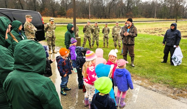 Fort McCoy community members plant trees April 25, 2025, during a tree-planting event at Fort McCoy, Wis. Dozens of community members planted 500 trees on the installation cantonment to establish a tree break. The installation also received its...