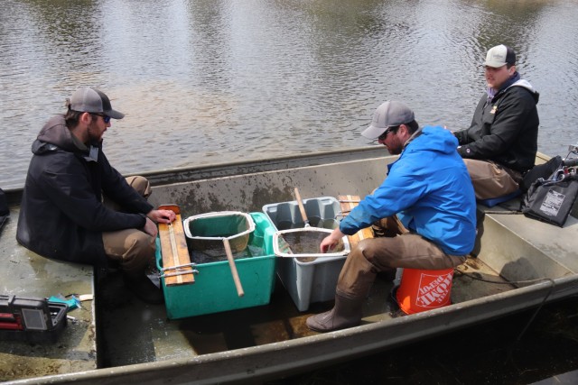 Watershed Management Biologist Derek Maki and Watershed Management Specialists Jaden Gallardo and Trenton Foreman with Colorado State University conduct a fish survey April 22, 2025, at Stillwell Lake on South Post at Fort McCoy, Wis. They...