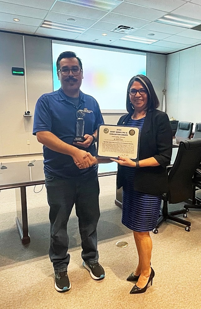 Curiel receiving AMSO award from Ms. Isabel Goode