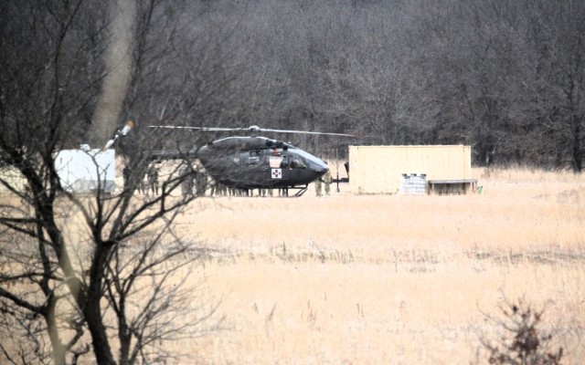 Personnel with the 1st Battalion, 147th Aviation Regiment of the Wisconsin National Guard conduct hot and cold patient load training April 11, 2025, during drill training at Fort McCoy, Wis. From April 11-13, 2025, Soldiers with the 1st Battalion,...