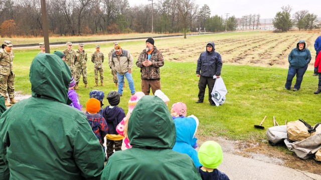 Fort McCoy community members plant trees April 25, 2025, during a tree-planting event at Fort McCoy, Wis. Dozens of community members planted 500 trees on the installation cantonment to establish a tree break. The installation also received its...