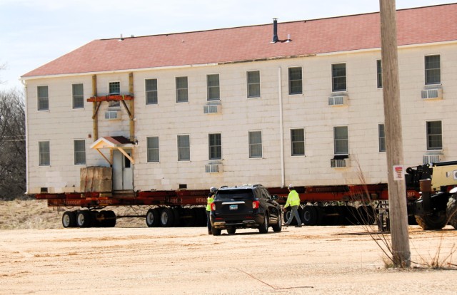 A fourth barracks building from the 1600 block at Fort McCoy, Wis., is shown being moved April 16, 2025, from the 1600 block to another area of the installation. These buildings will eventually be reset at another area of the post so new...