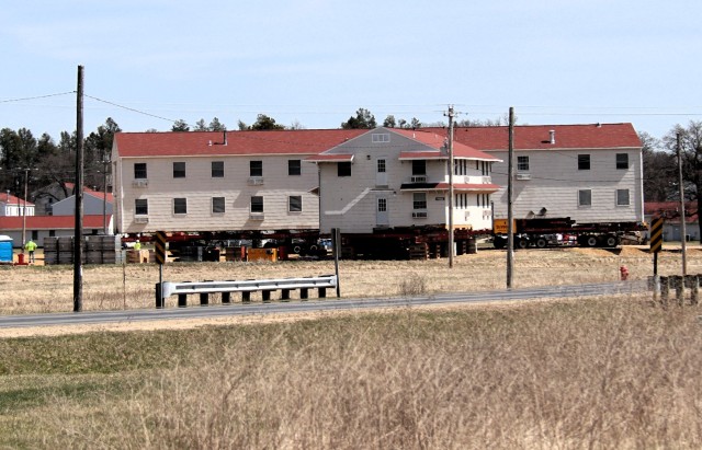 A barracks building from the 1600 block at Fort McCoy, Wis., is shown being moved April 16, 2025, from the 1600 block to another area of the installation. Contractors are moving several buildings in 2025. These buildings will eventually be reset...