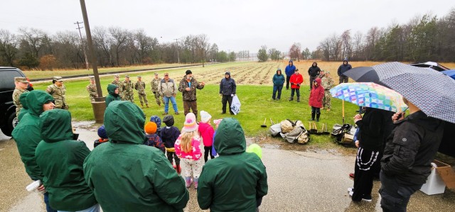 Fort McCoy community members plant trees April 25, 2025, during a tree-planting event at Fort McCoy, Wis. Dozens of community members planted 500 trees on the installation cantonment to establish a tree break. The installation also received its...