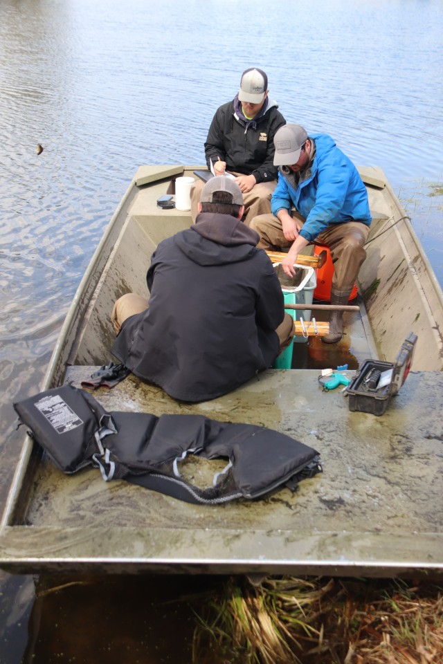 Watershed Management Biologist Derek Maki and Watershed Management Specialists Jaden Gallardo and Trenton Foreman with Colorado State University conduct a fish survey April 22, 2025, at Stillwell Lake on South Post at Fort McCoy, Wis. They...