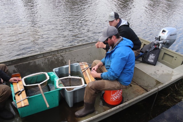 Watershed Management Biologist Derek Maki and Watershed Management Specialists Jaden Gallardo and Trenton Foreman with Colorado State University conduct a fish survey April 22, 2025, at Stillwell Lake on South Post at Fort McCoy, Wis. They...