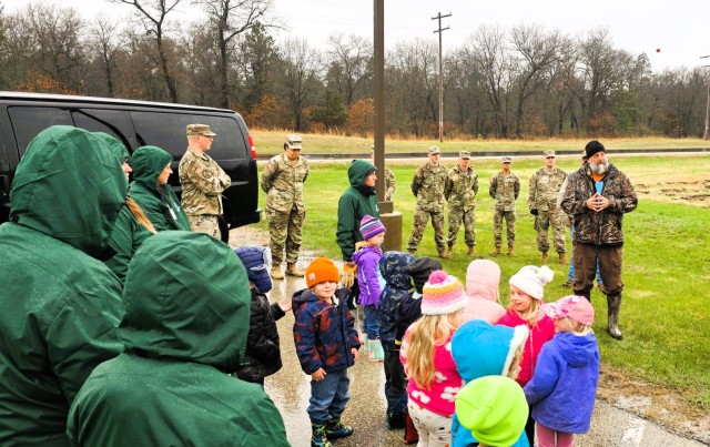 Fort McCoy community members plant trees April 25, 2025, during a tree-planting event at Fort McCoy, Wis. Dozens of community members planted 500 trees on the installation cantonment to establish a tree break. The installation also received its...