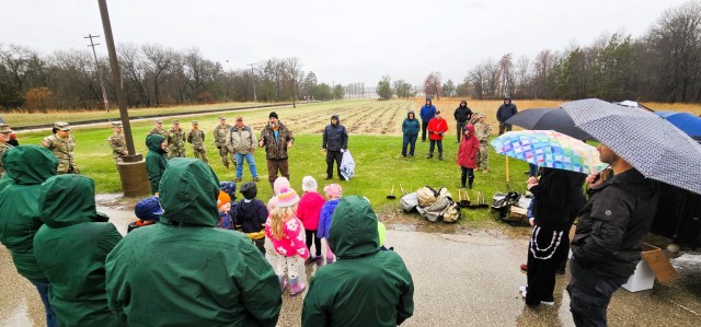 Fort McCoy community members plant trees April 25, 2025, during a tree-planting event at Fort McCoy, Wis. Dozens of community members planted 500 trees on the installation cantonment to establish a tree break. The installation also received its...