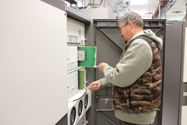 Fort McCoy Network Enterprise Center employee Kenneth O’Connell disconnects the last legacy Time Division Multiplexing equipment for telecommunications Nov. 21, 2024, at Fort McCoy, Wis. Fort McCoy changed its telecommunications to voice over...