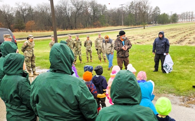 Fort McCoy community members plant trees April 25, 2025, during a tree-planting event at Fort McCoy, Wis. Dozens of community members planted 500 trees on the installation cantonment to establish a tree break. The installation also received its...