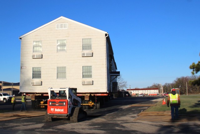 A barracks building from the 1600 block at Fort McCoy, Wis., is shown being moved April 16, 2025, from the 1600 block to another area of the installation. Contractors are moving several buildings in 2025. These buildings will eventually be reset...