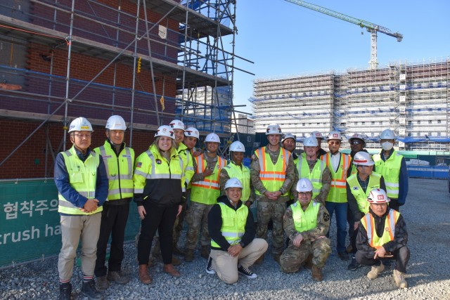 Soldiers from the U.S. Army Garrison Humphreys Better Opportunities for Single Soldiers (BOSS) program and U.S. Army Corps of Engineers employees visiting a project site.