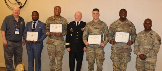 From left are retired Navy Capt. Rick West, president of Huntsville Chapter of the Military Officers Association of America; commissioning ROTC cadets Tray Robinson and Justin Arrington; retired Maj. Gen. Vincent “Vinny” Boles, the luncheon...