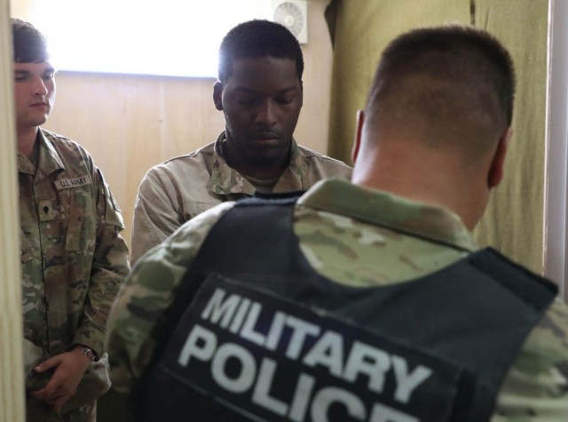 Competitors in the fourth annual Army interrogation competition, “Tranquil Storm,” conduct mass screenings of detained personnel at the Louisiana National Guard Training Center in Pineville, April 29.