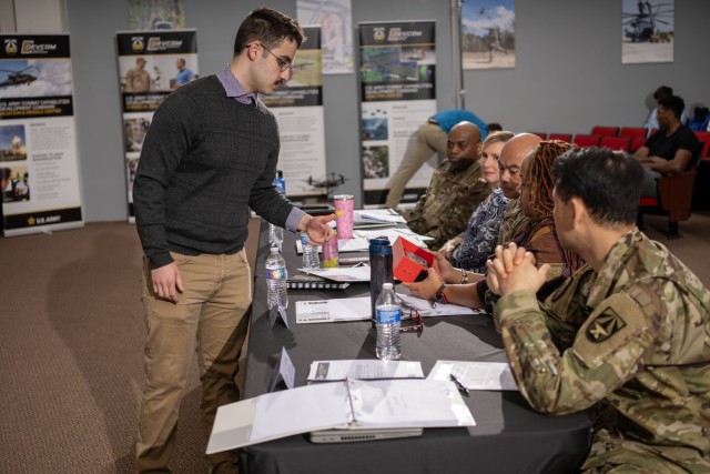 A student from team Norwich Cadets, comprised of students from Norwich University, presents their portable, energy dense charging system project to the judges of U.S. Army Combat Capabilities Development Command, or DEVCOM, Science, Technology,...