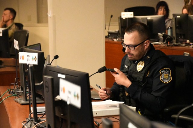 FORT CARSON, Colo. — Sgt. Andrew Seager, Fort Carson operation sergeant, takes a call from the Directorate of Emergency Services desk in the emergency operations center during the Fort Carson integrated protection exercise May 6, 2025. The...