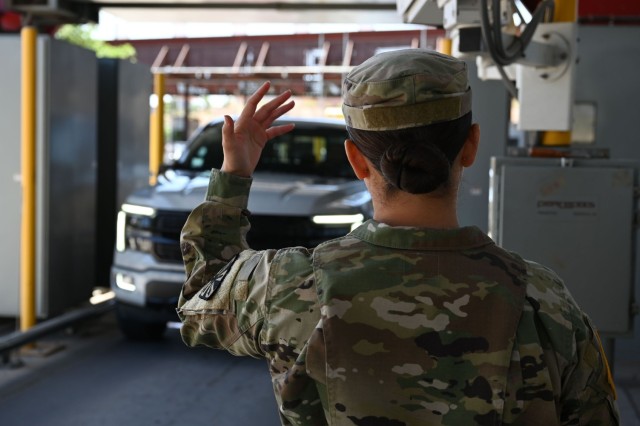 A U.S. Soldier with the Arizona Army National Guard signals for a vehicle to pass through the X-ray machine at the Mariposa Port of Entry in Nogales, Arizona, April 29, 2025. The Arizona National Guard and U.S. Customs and Border Protection are...